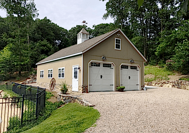 24’ x 40’ 8 Pitch Garage built on top of customer’s 22’’ high stem wall. Shown with optional 9’ x 8’ Custom Carriage Doors and 42’’ Elite Cupola