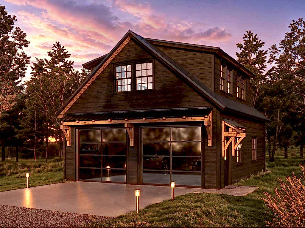 If you’ve been eyeing one of our premium timber frame garages, you’ll love the Ridgeview Loft. At first glance, its striking design, complete with pent roofs over the garage and entry doors, gives it the sophisticated look of a timber frame build. But this model doesn’t just look upscale—it delivers. With glass panel garage doors, black-trimmed windows, and a standing seam metal roof, the Ridgeview Loft checks all the boxes for modern, high-end appeal. When compared to our classic 2-story A-frame garage, the Ridgeview Loft clearly sets itself apart. Its steeper pitched roof and extended dormers make the second floor dramatically more spacious and versatile. Whether you're envisioning turning this space into a mancave, home office, art studio, or guest space, the Ridgeview Loft offers the flexibility to bring your vision to life—while maintaining exceptional value.