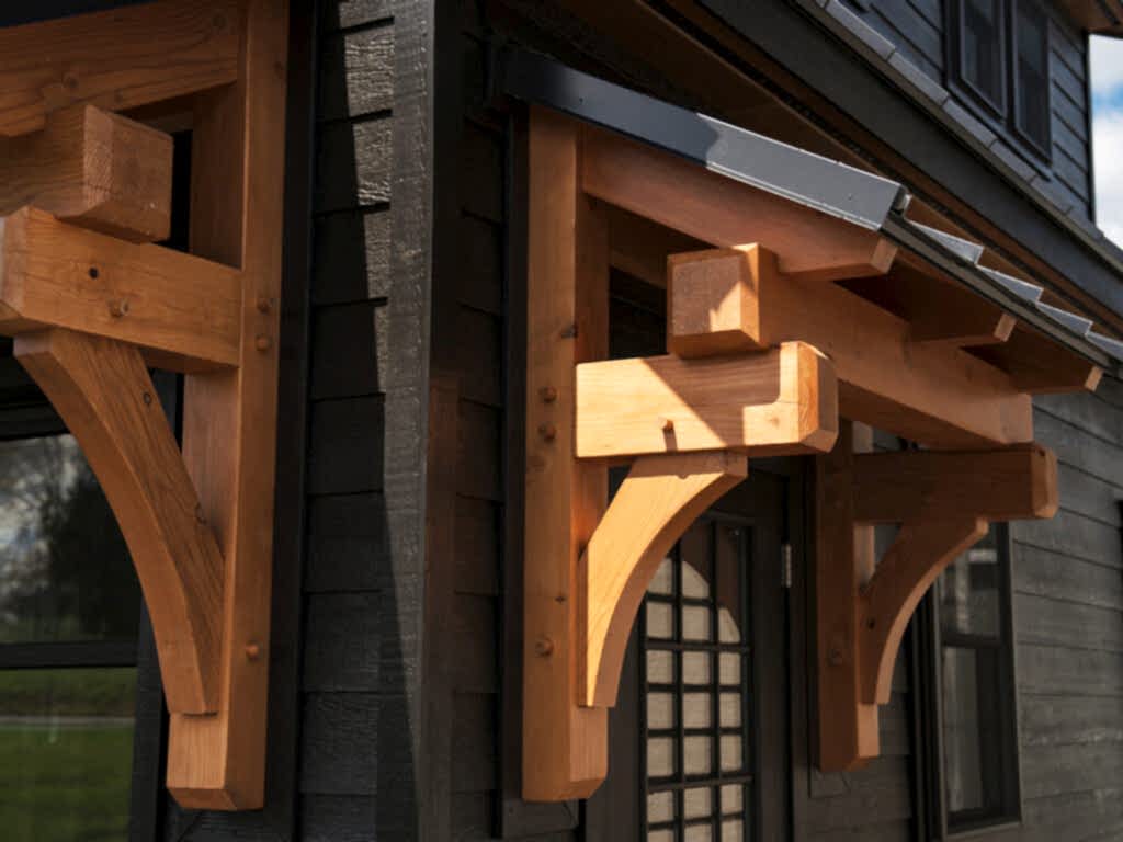If you’ve been eyeing one of our premium timber frame garages, you’ll love the Ridgeview Loft. At first glance, its striking design, complete with pent roofs over the garage and entry doors, gives it the sophisticated look of a timber frame build. But this model doesn’t just look upscale—it delivers. With glass panel garage doors, black-trimmed windows, and a standing seam metal roof, the Ridgeview Loft checks all the boxes for modern, high-end appeal. When compared to our classic 2-story A-frame garage, the Ridgeview Loft clearly sets itself apart. Its steeper pitched roof and extended dormers make the second floor dramatically more spacious and versatile. Whether you're envisioning turning this space into a mancave, home office, art studio, or guest space, the Ridgeview Loft offers the flexibility to bring your vision to life—while maintaining exceptional value.